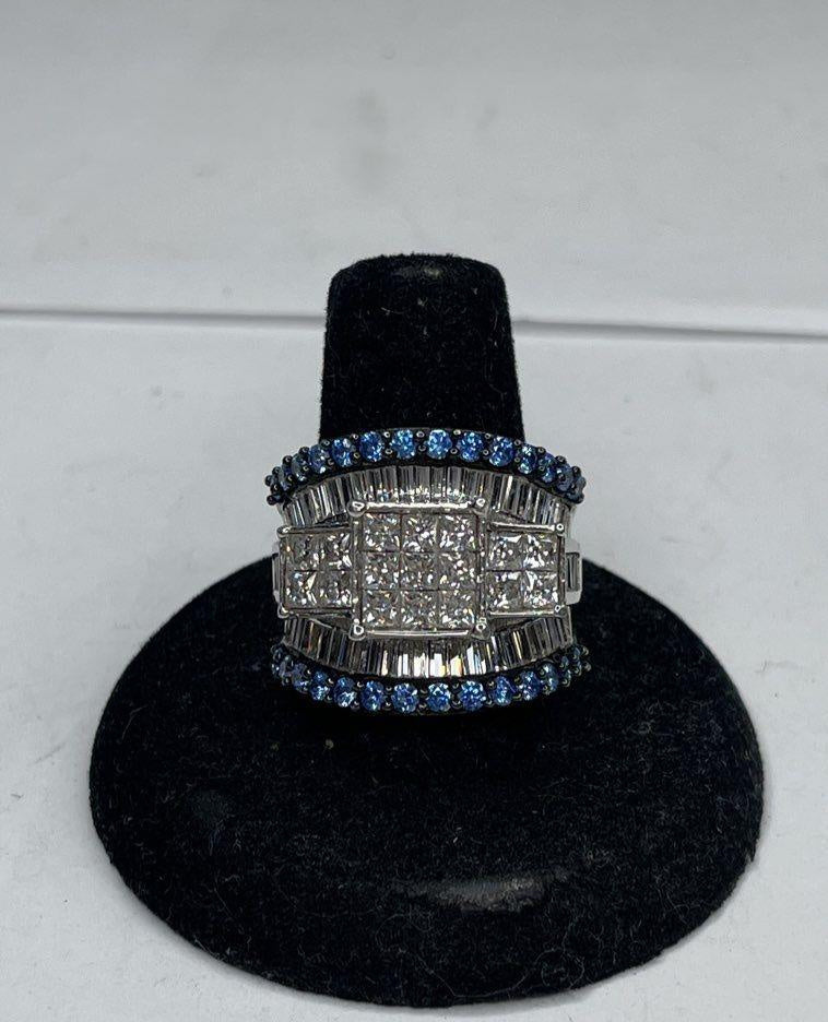 Wide silver tiered cocktail ring with clear baguette and princess-cut stones and blue accents, view 2