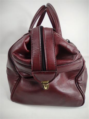 Burgundy leather overnight travel bag with dual handles and top zip, view 5
