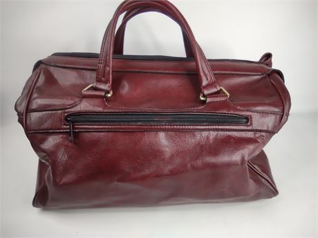 Burgundy leather overnight travel bag with dual handles and top zip, view 6
