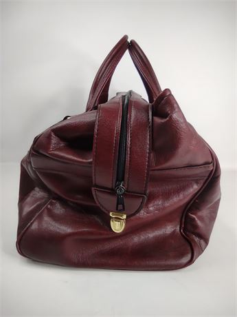 Burgundy leather overnight travel bag with dual handles and top zip, view 7
