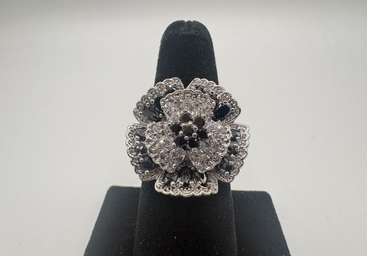 Statement ring with layered floral clusters of black and clear rhinestones, view 2