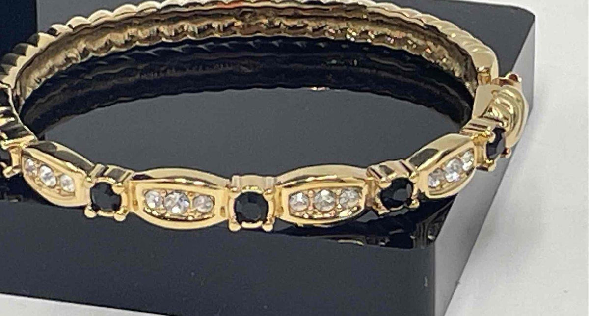 Swarovski gold-tone hinged bangle with clear crystal trios and jet black crystal accents, view 6