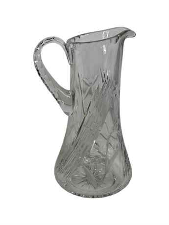 Tall clear cut glass pitcher with floral and leaf decoration and textured handle, view 2