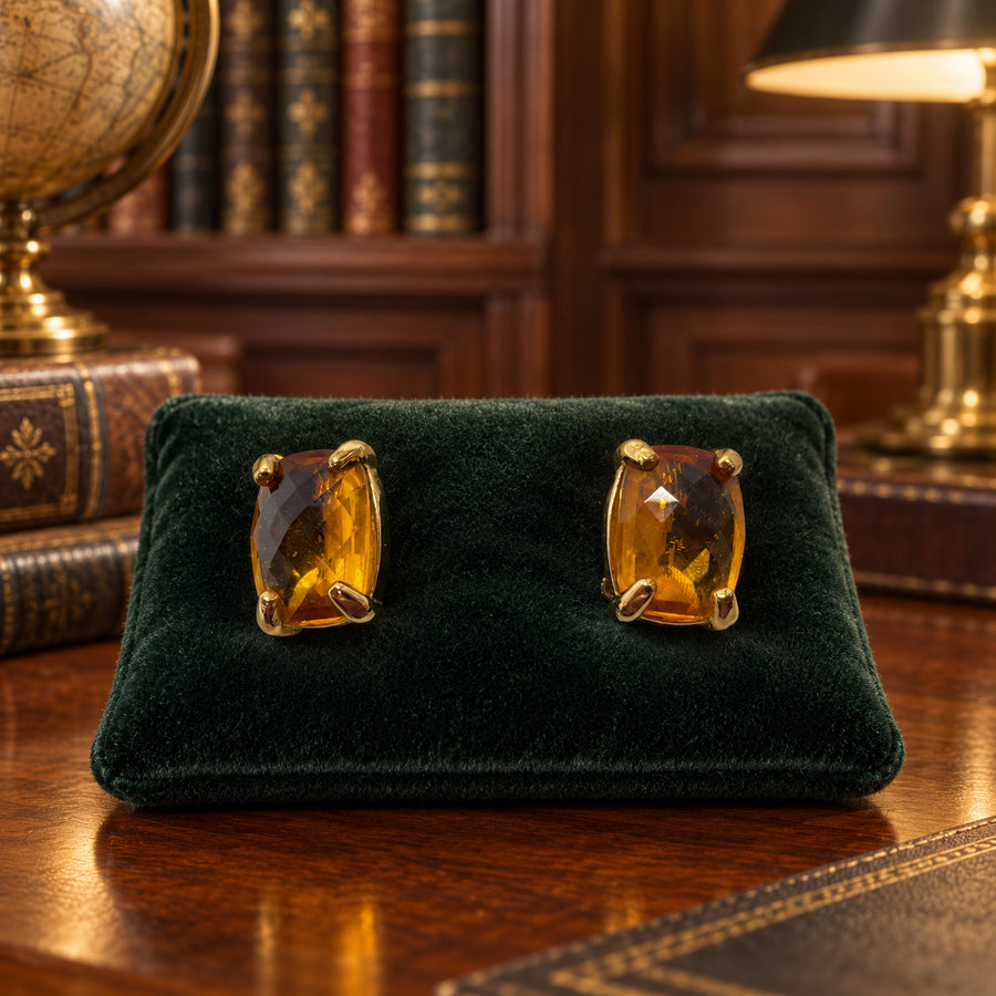 Gold-tone clip-on earrings with single elongated cushion-cut amber crystals
