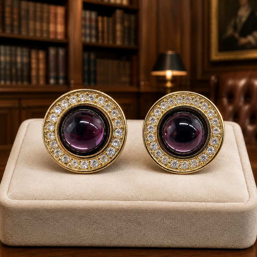 Monet round gold-tone clip-on earrings with domed purple centers and clear rhinestone halos