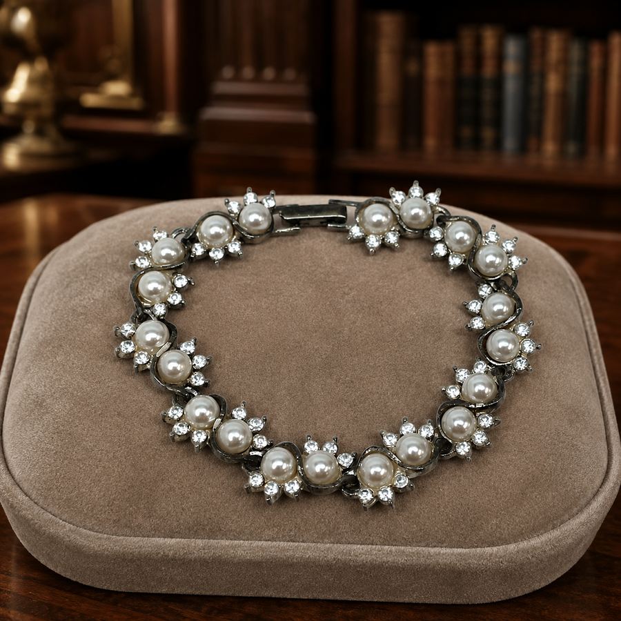 Silver-tone link bracelet with faux pearls and clear rhinestones