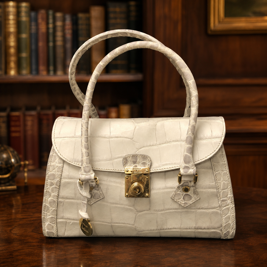 Dooney and Bourke white croc-embossed satchel with gold-tone turn-lock and logo medallion