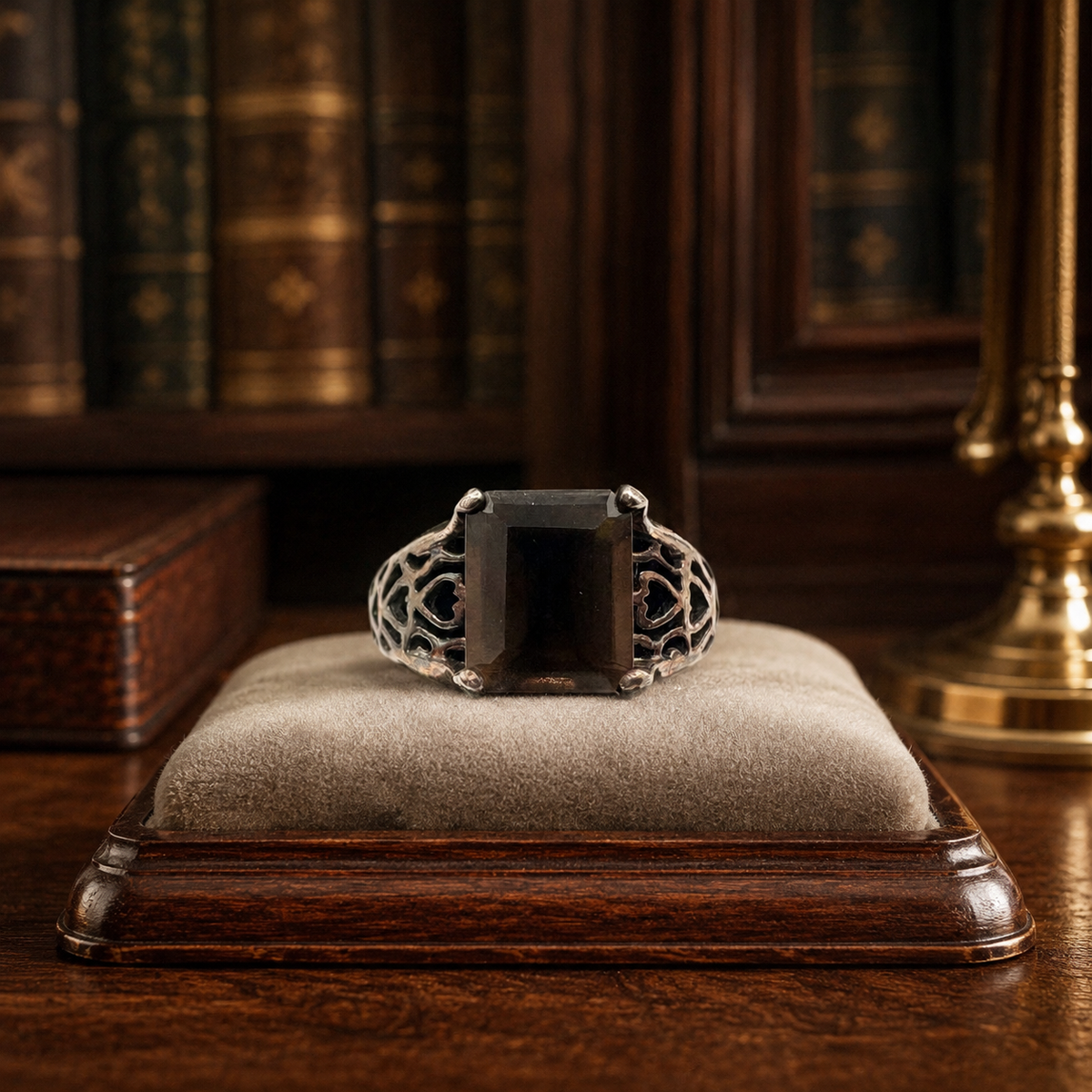 Signed NV sterling silver ring with rectangular smoky brown faceted stone in openwork gallery