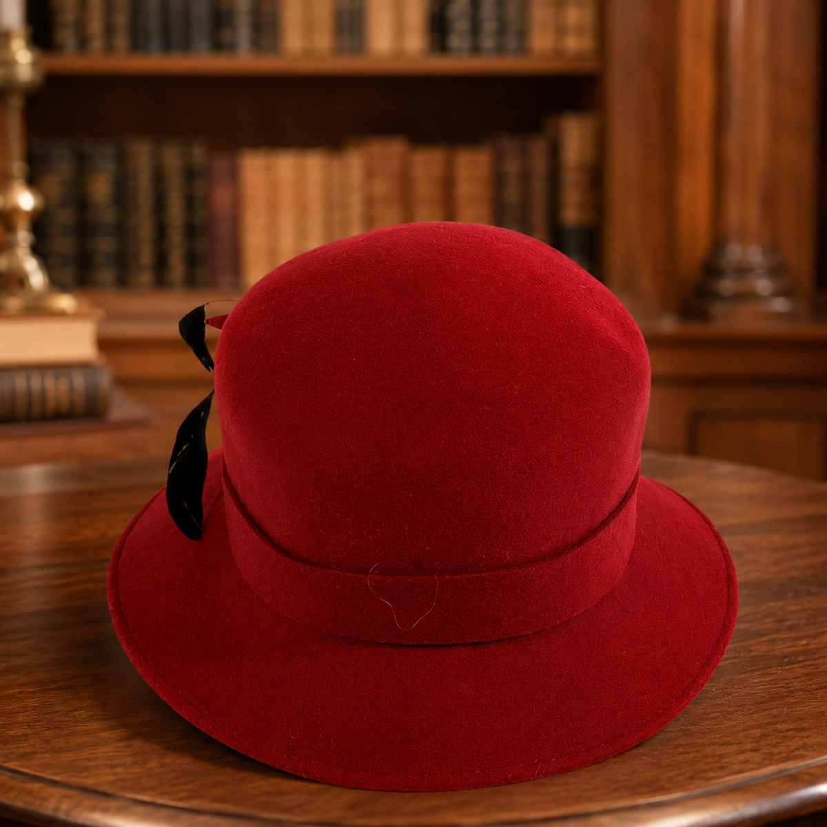 Red wool felt cloche hat with black ribbon and feather trim