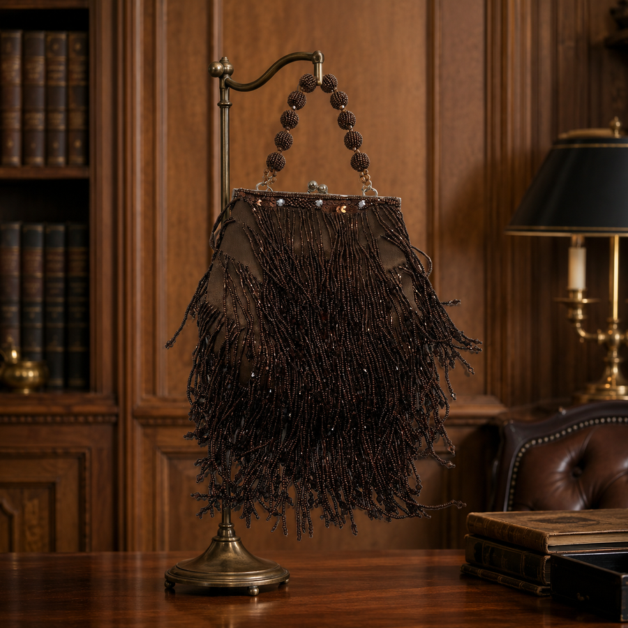 Small brown framed handbag with beaded handle and layered beaded tassel fringe