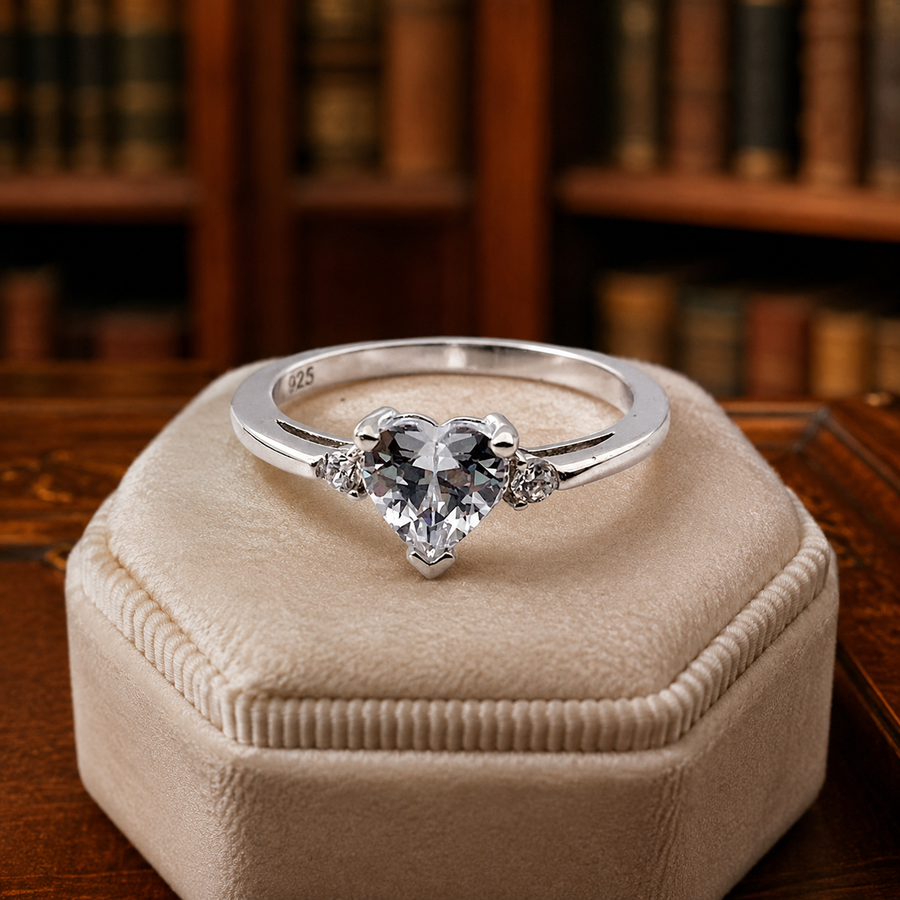 Silver-tone heart promise ring with heart-shaped center stone and clear accent stones