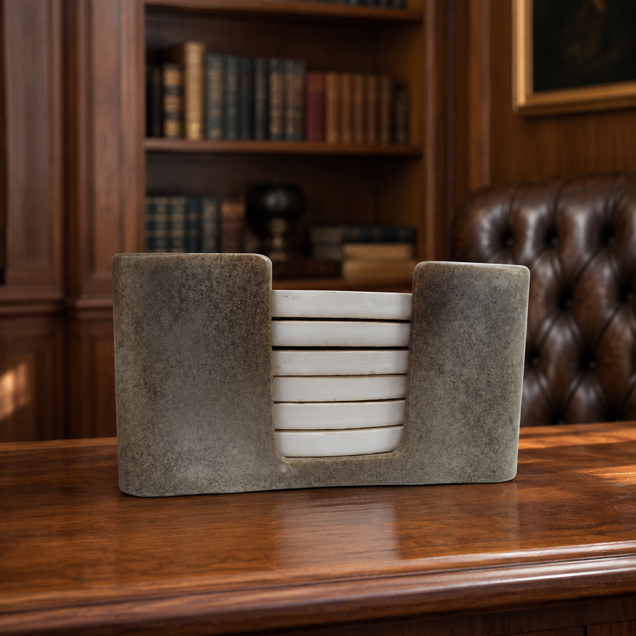 Six round terracotta coasters hand painted with classical Greek pottery-style figures, with holder