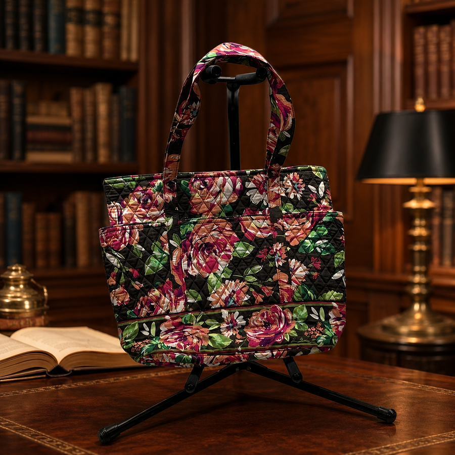 Multicolor floral quilted fabric tote on a dark ground with double shoulder straps