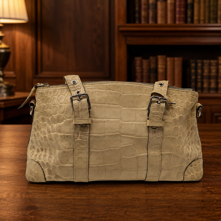 Beige crocodile-embossed leather satchel with rolled handles and silver-tone hardware