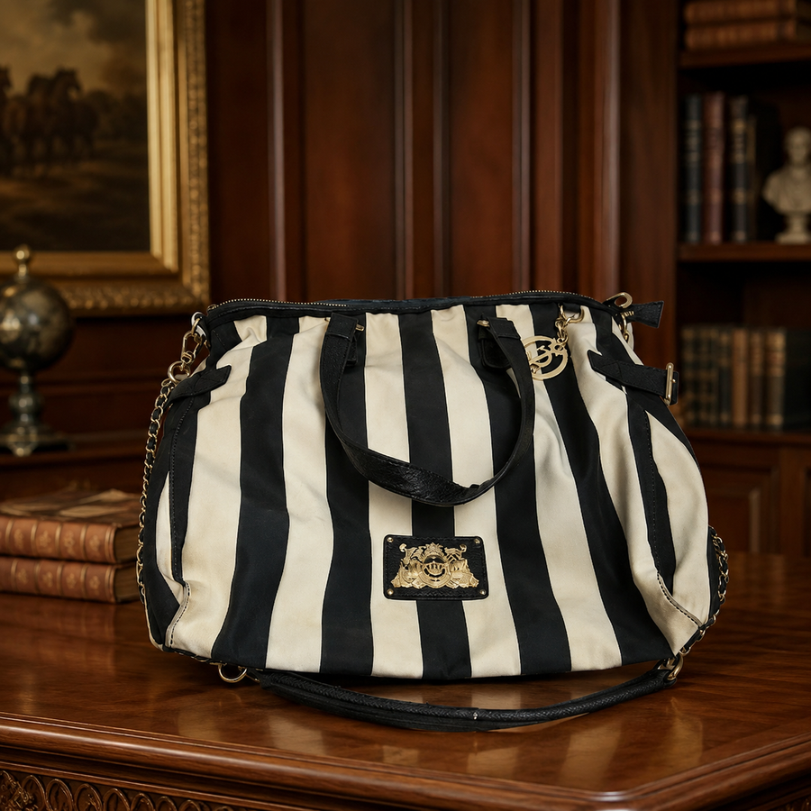 Black and white striped tote with black trim and gold-tone accents