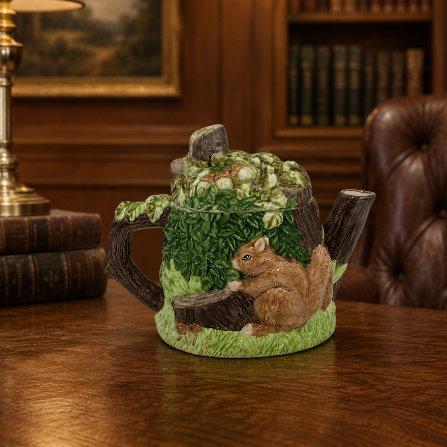 Ceramic teapot with woodland scene of trees and squirrels