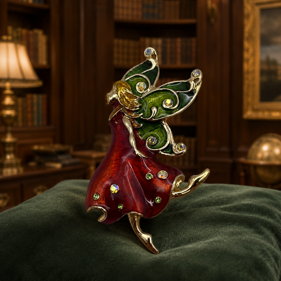Gold-tone enamel fairy brooch with red skirt, green wings and rhinestones