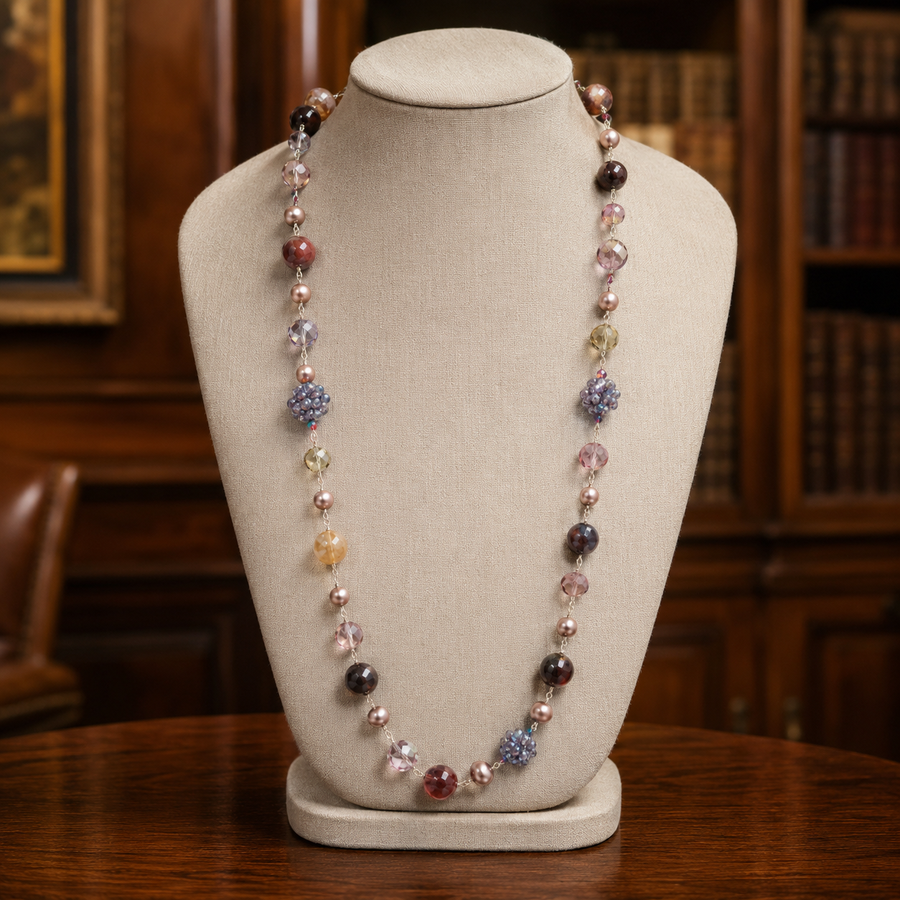 Long beaded necklace of burgundy, amber, smoky green and lavender beads with pearl-like beads