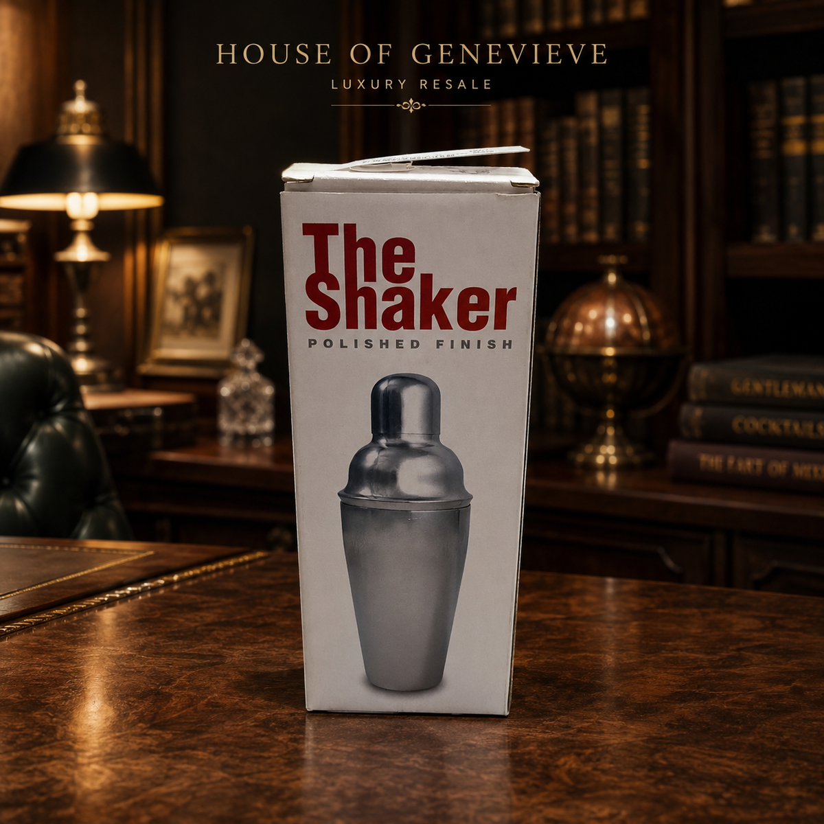 Polished steel-finish three-piece cocktail shaker with jigger cap and original box