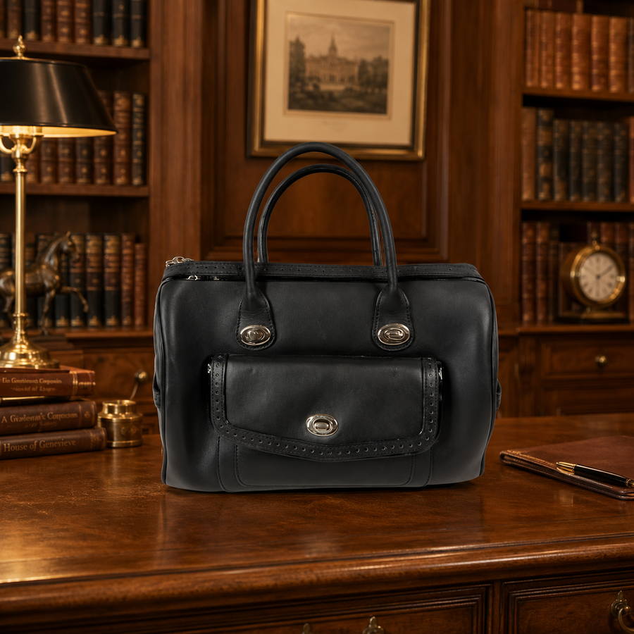Black leather handbag with silver-tone hardware and turn-lock front pocket