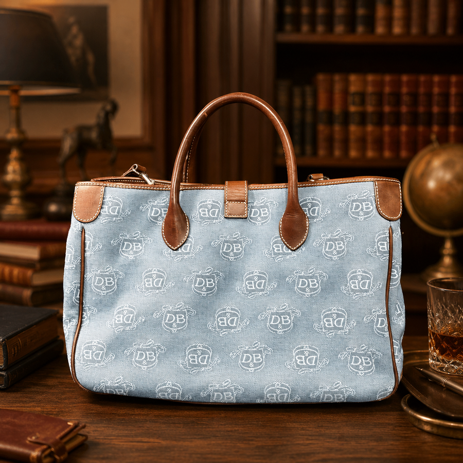 Blue monogram canvas satchel tote with brown leather trim and rolled top handles