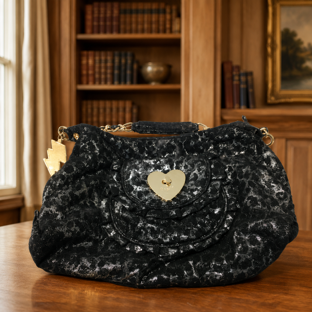 Black and silver metallic Betseyville purse with heart plate and lightning bolt charm