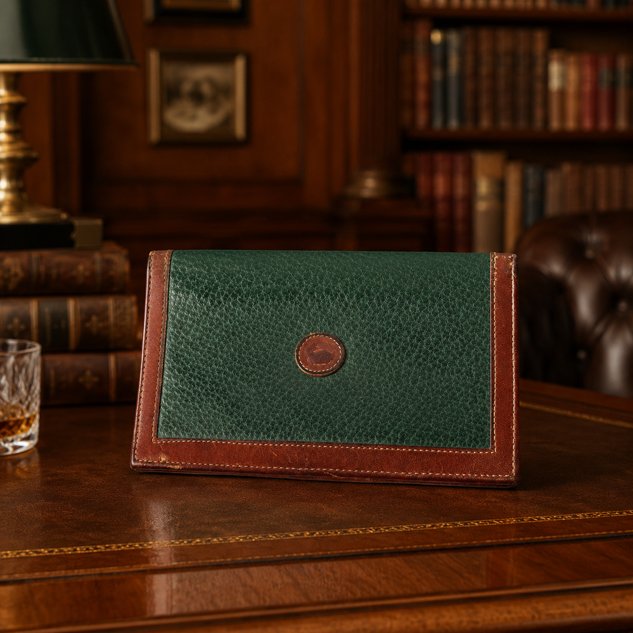 Dooney and Bourke green textured leather bifold wallet with brown leather trim