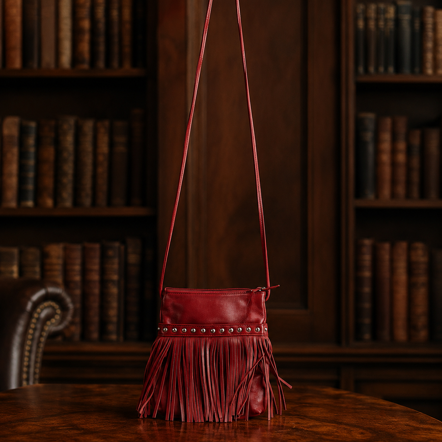 Red leather crossbody bag with front fringe and silver-tone studs