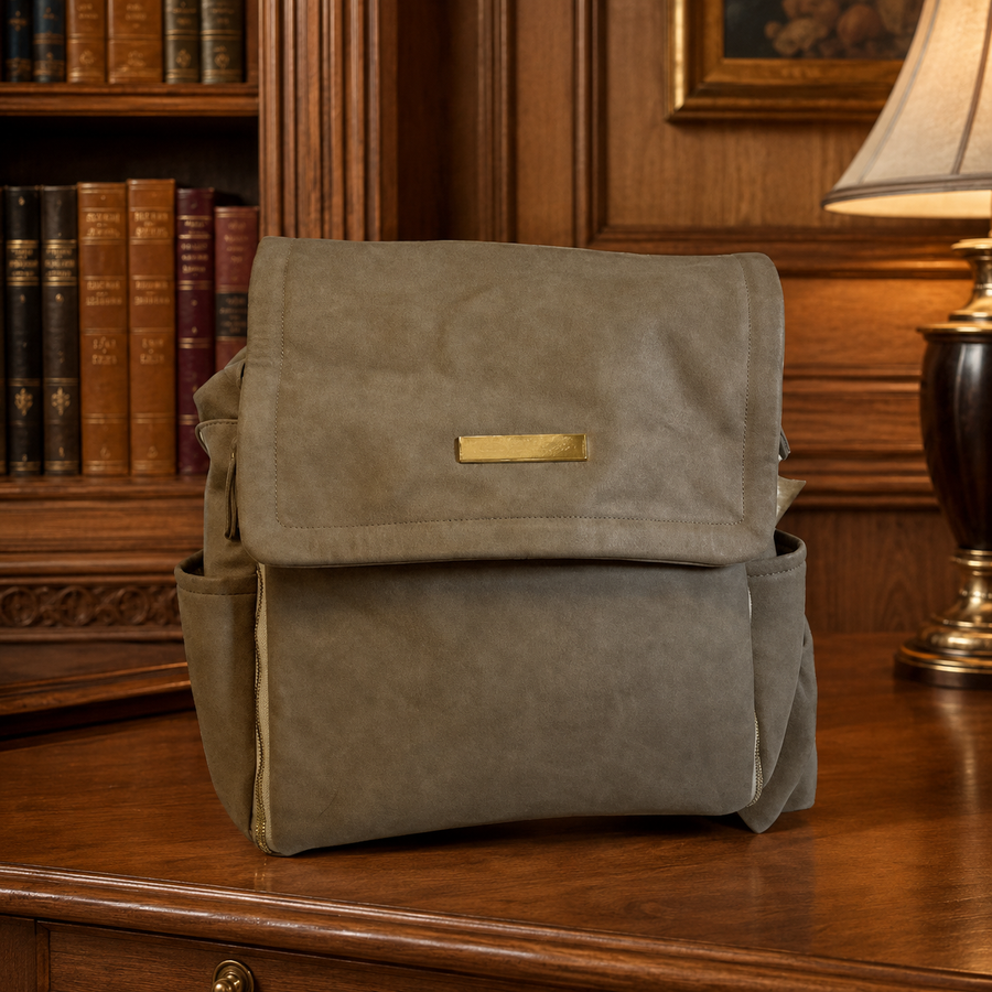 Petunia Pickle Bottom brown diaper bag with foldover flap and floral lining