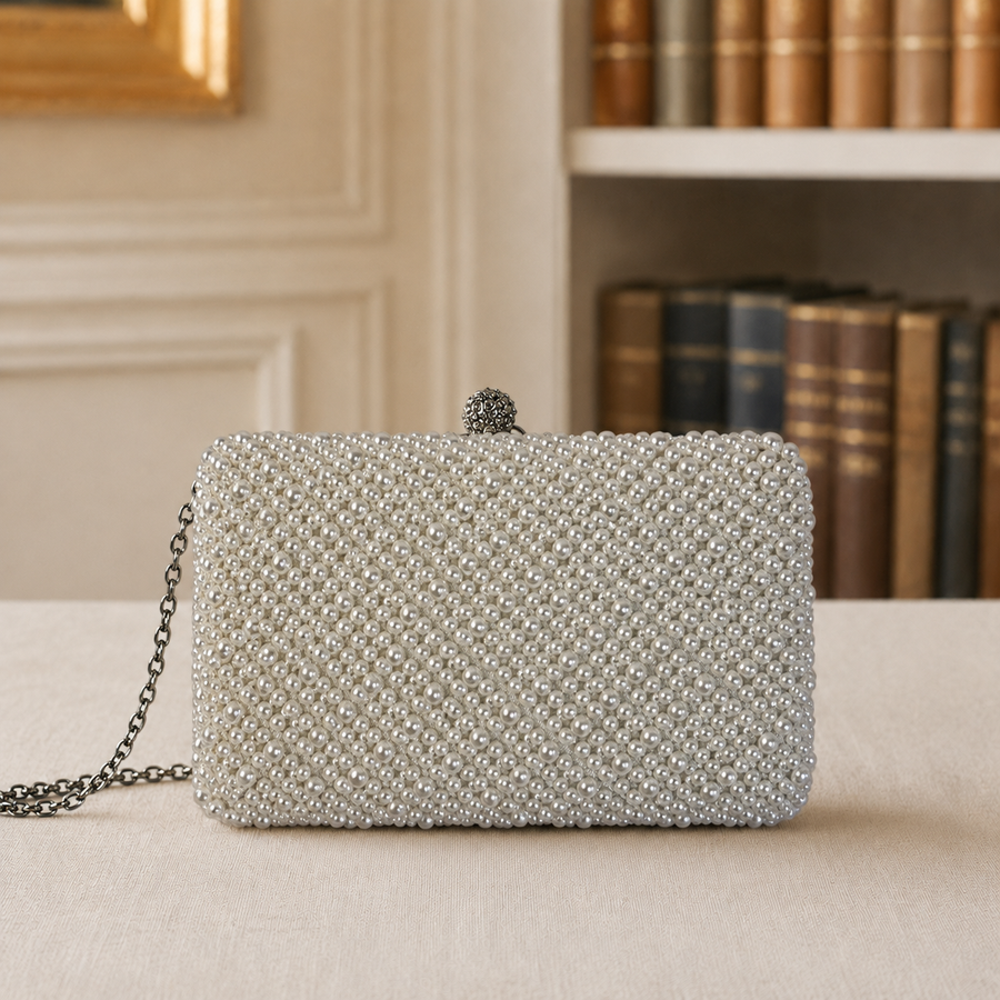 White beaded evening clutch with mixed pearl-style beads, decorative clasp and silver-tone chain