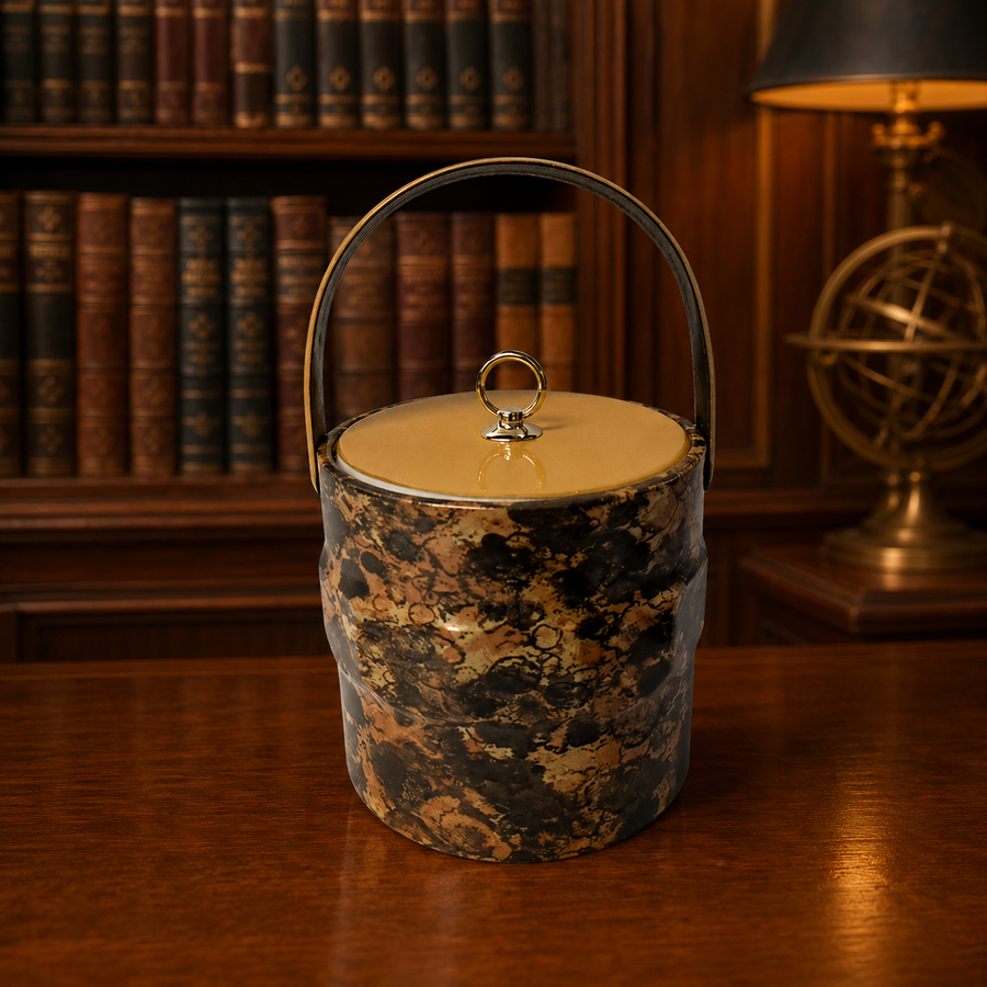 Tortoiseshell-style marbled ice bucket with mustard-yellow lid, gold-tone ring pull and chrome-tone handle