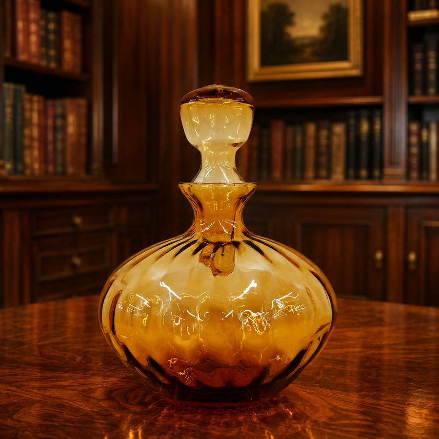 Amber glass decanter with optic ribbed rounded body and faceted stopper