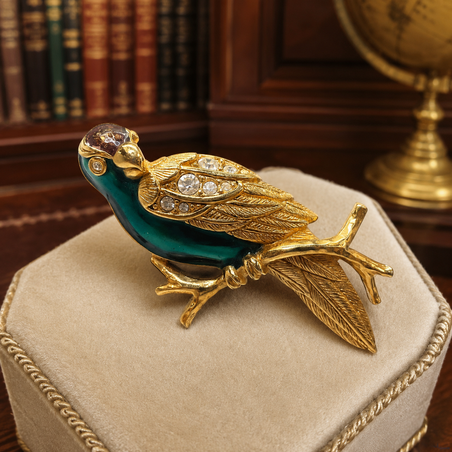 Gold-tone parrot brooch with green enamel and rhinestones