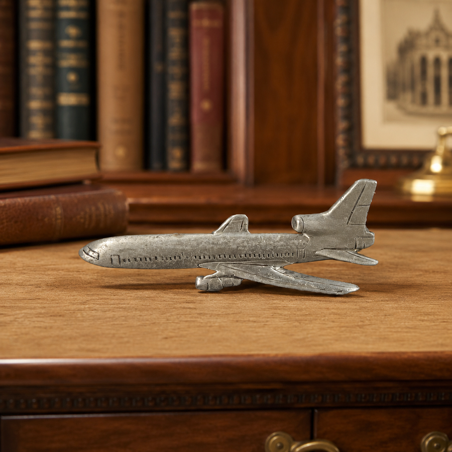 Airliner tie tack marked L1011 on the reverse, depicting a three-engine jet