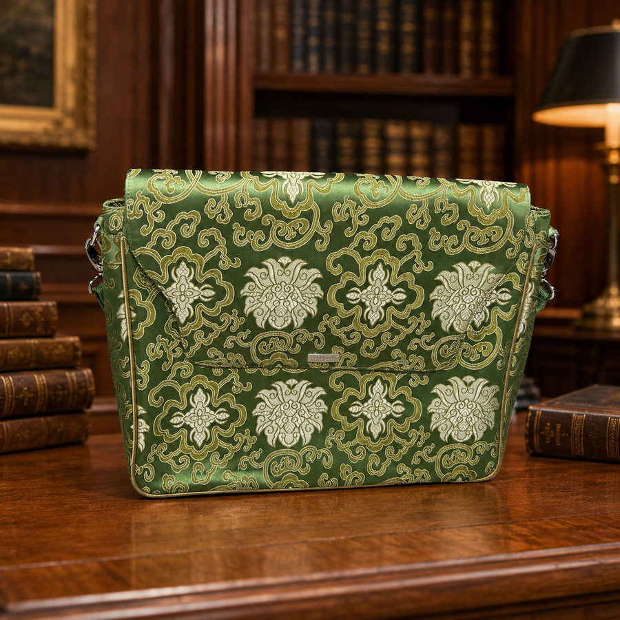 Green damask pattern flap-front briefcase bag with shoulder strap and pink lining