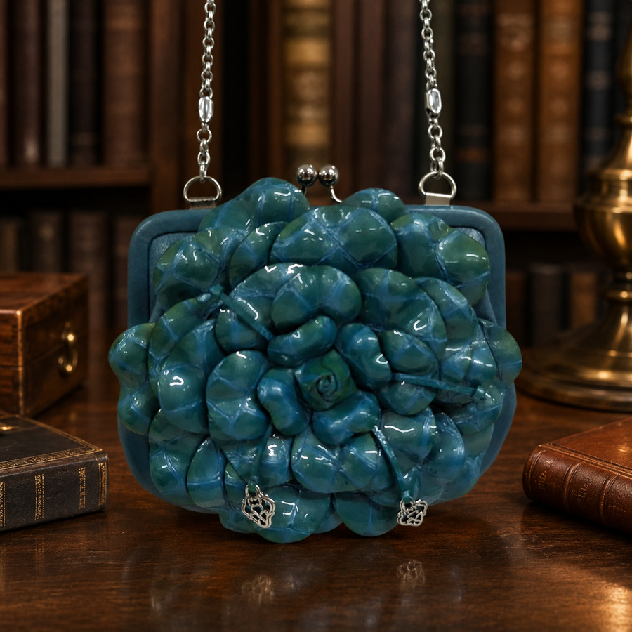 Blue coin purse handbag with sculpted flower front, kiss-lock frame and silver-tone chain strap