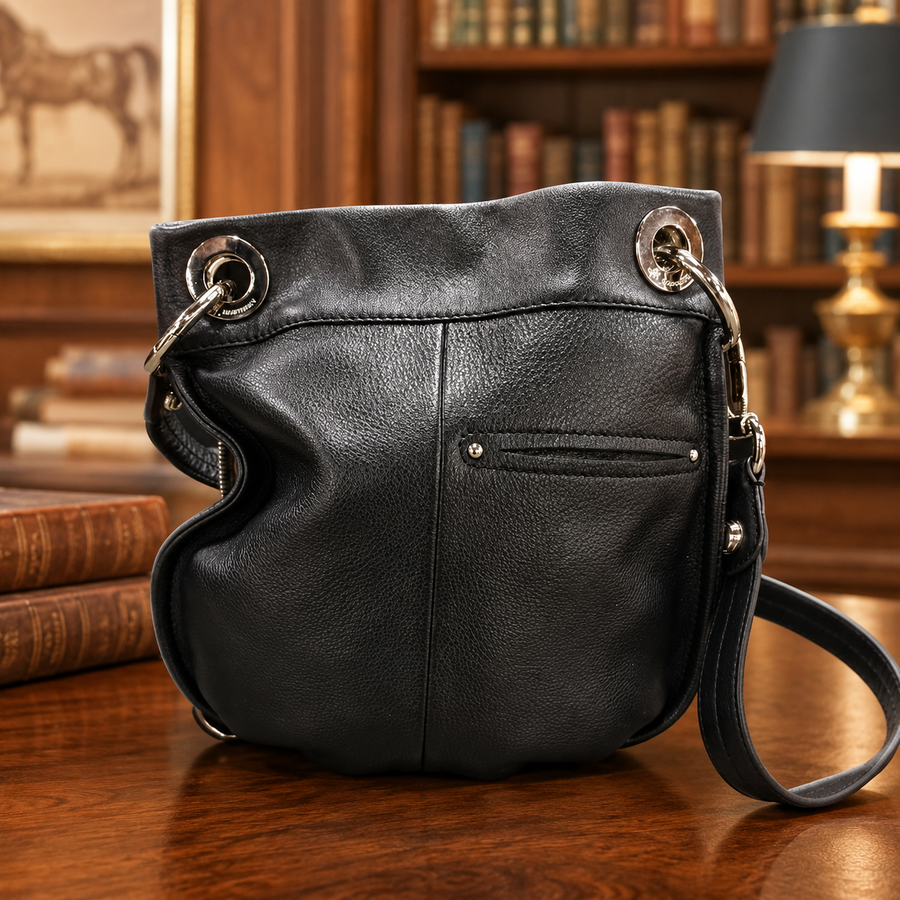 B. Makowsky black leather gathered shoulder bag with silver-tone ring hardware and leopard lining