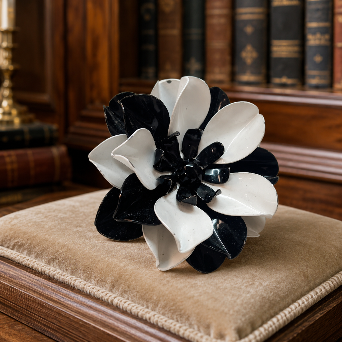 Black and white enamel flower brooch in gold-tone setting