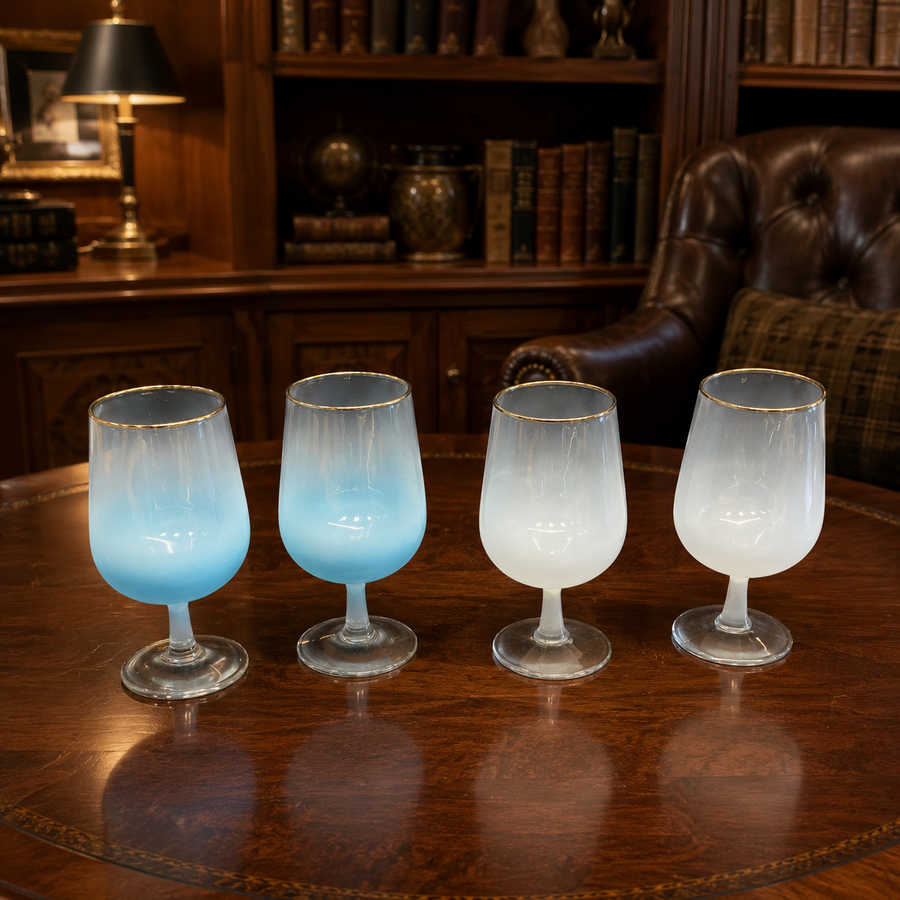 Four stemmed wine glasses with blue and white frosted color treatment