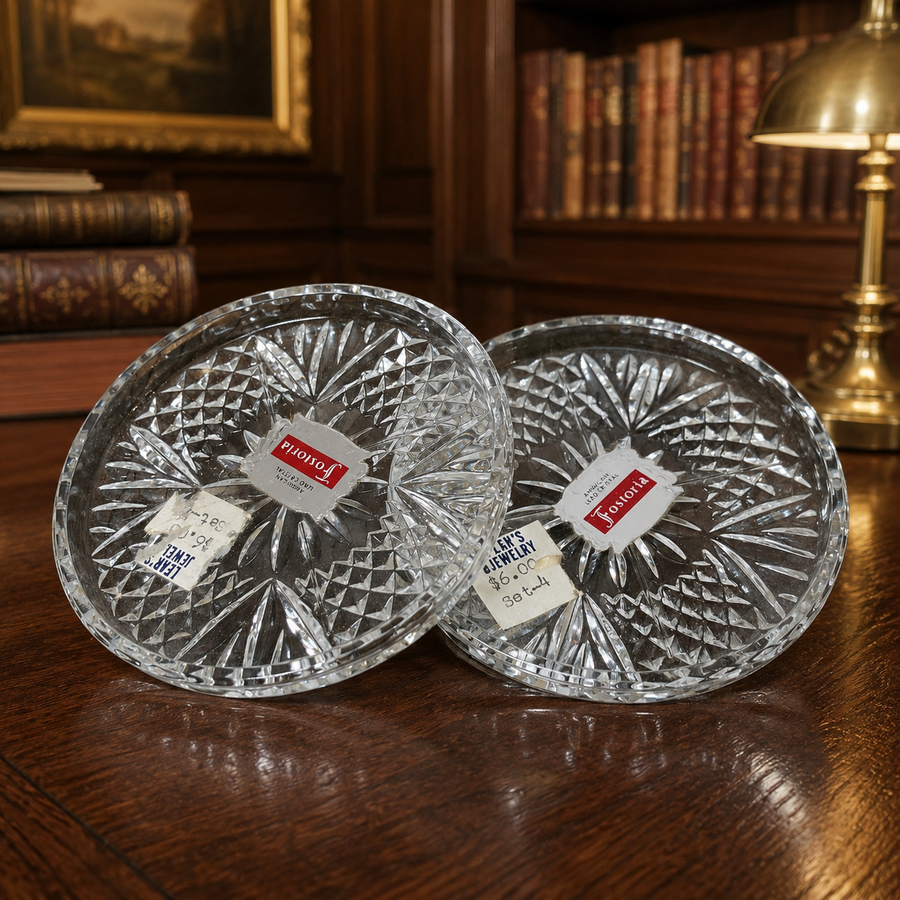 Two Fostoria American pattern clear pressed glass coasters with labels