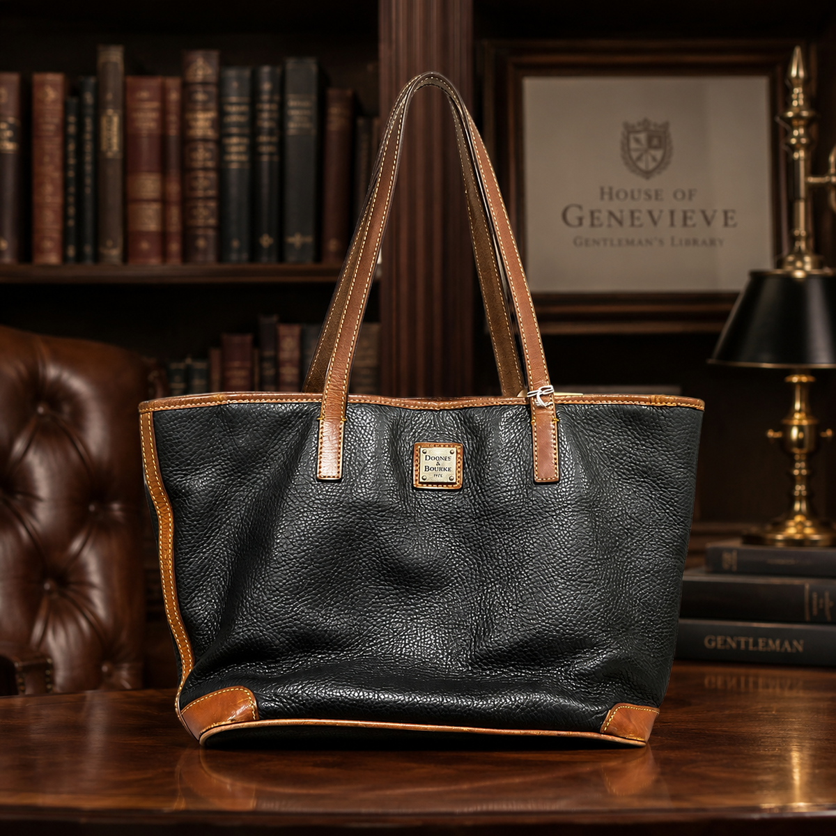 Black pebble grain shoulder bag with brown trim and long double straps, sold for repair or parts
