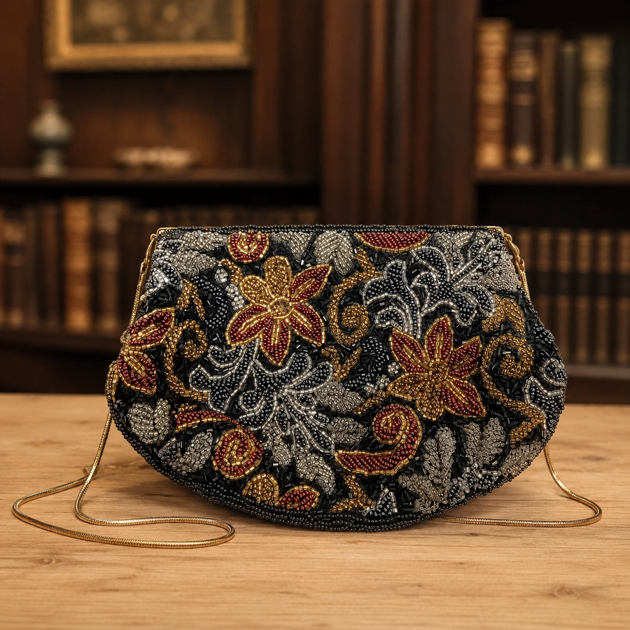 Floral beaded evening bag in jewel tones with black beaded trim, gold-tone frame and chain strap
