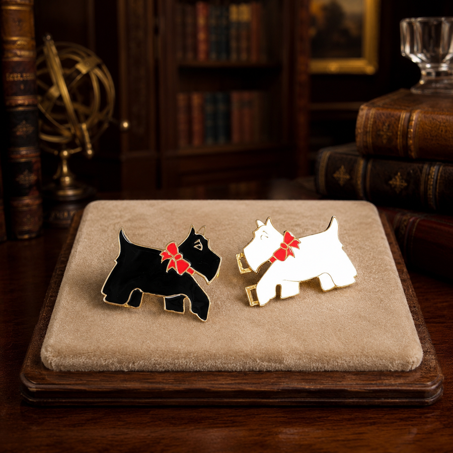 Two-part gold-tone belt buckle with black and white enamel Scottie dogs and red bows
