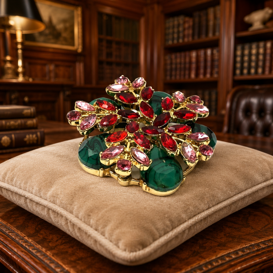Gold-tone double-tiered floral brooch with green banded cabochons and red and pink rhinestones