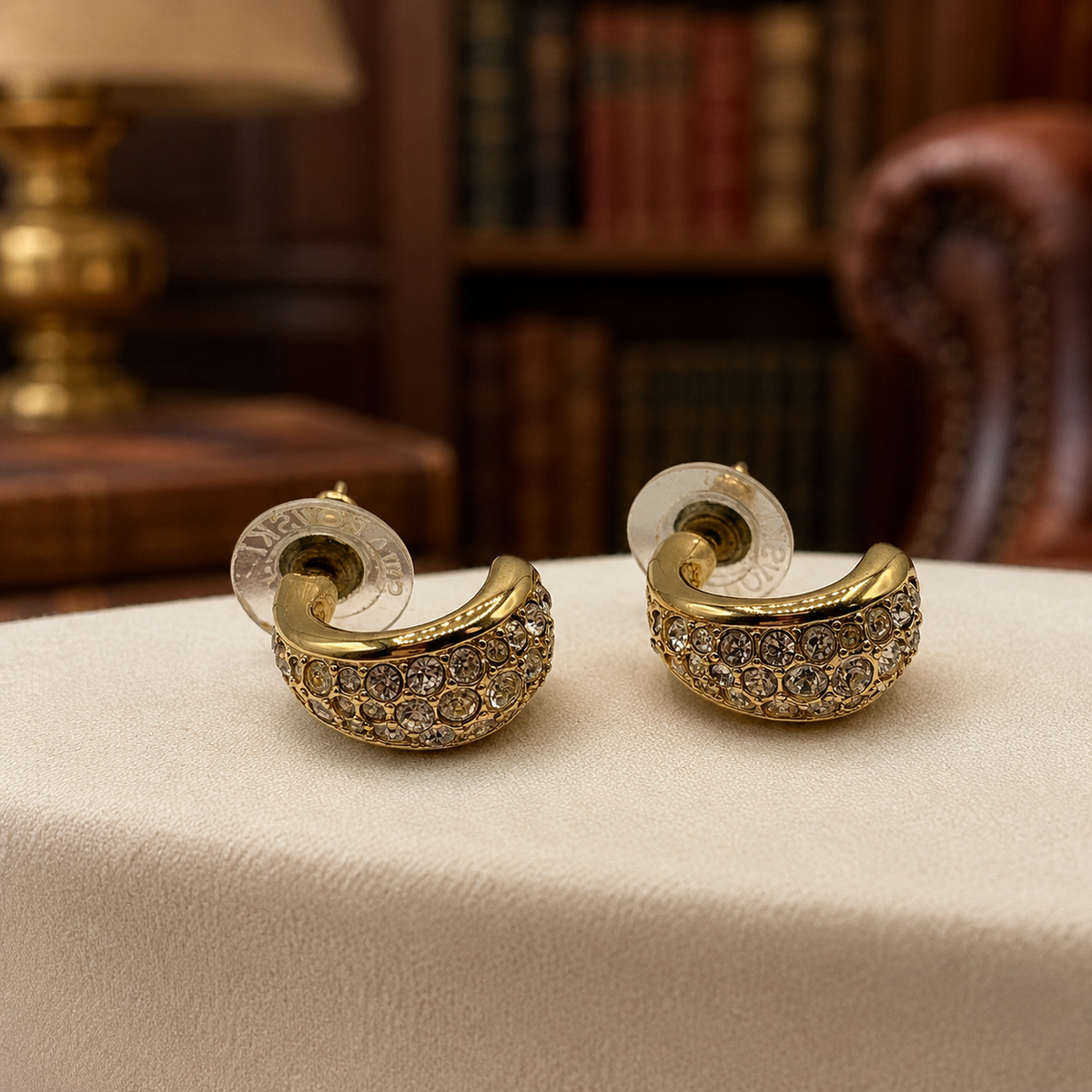 Signed Swarovski gold-tone J-hoop earrings with pavé crystal fronts