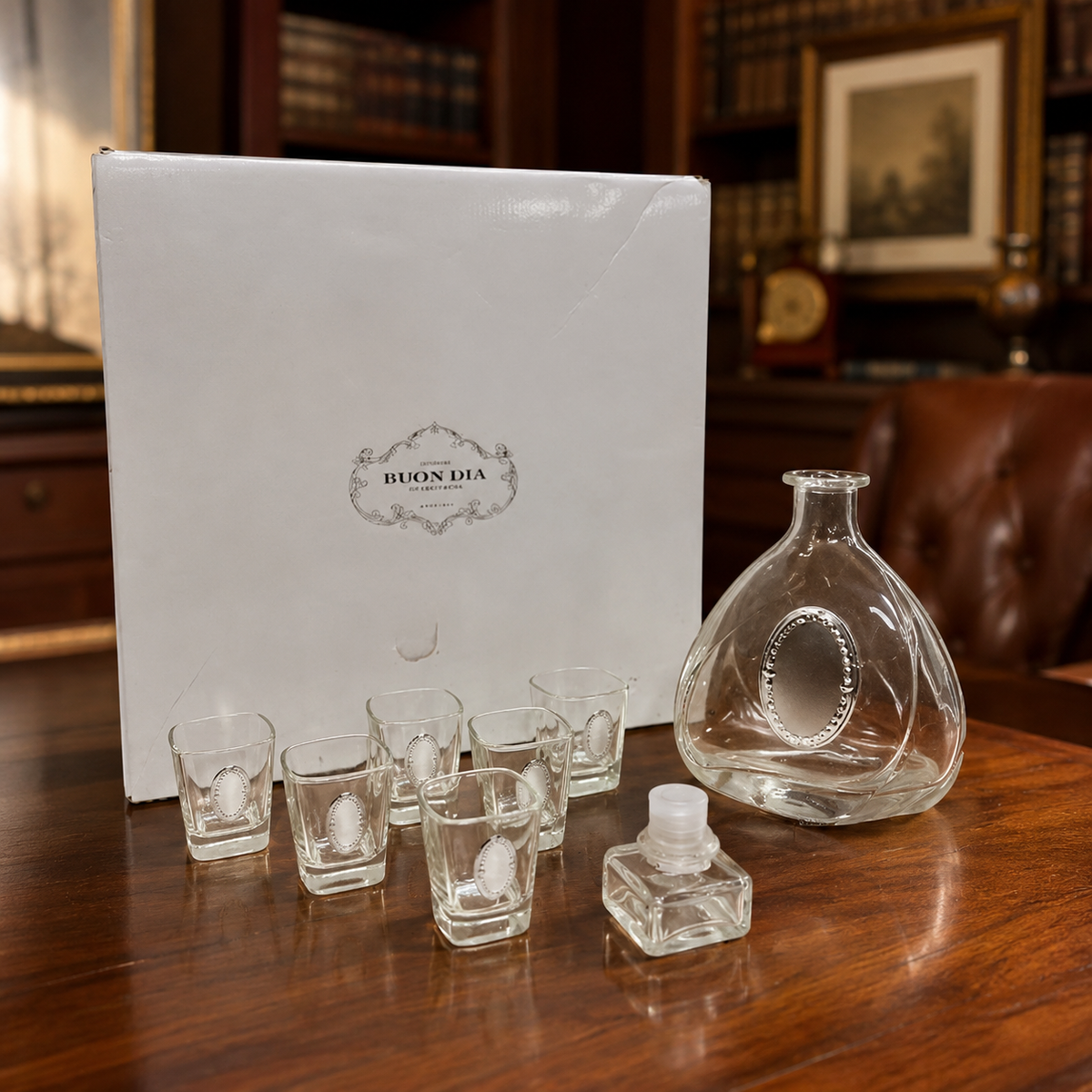 Faceted clear glass decanter with oval label detail, six shot glasses and white gift box