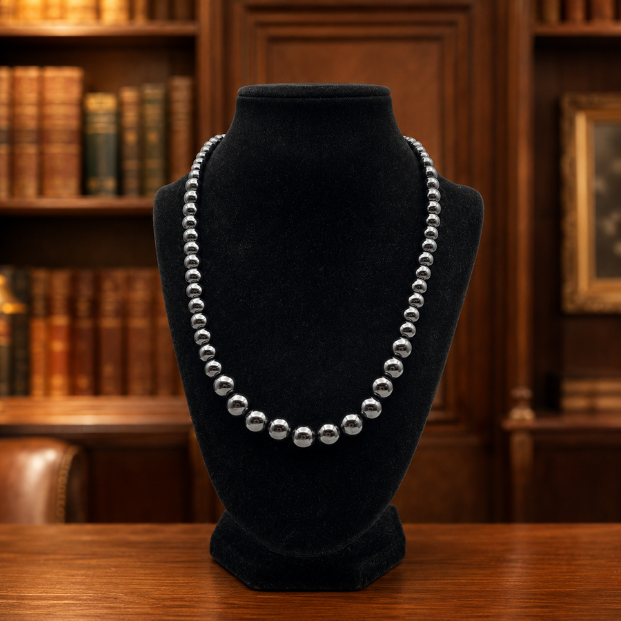 Graduated dark metallic bead necklace with silver spacers and lobster clasp