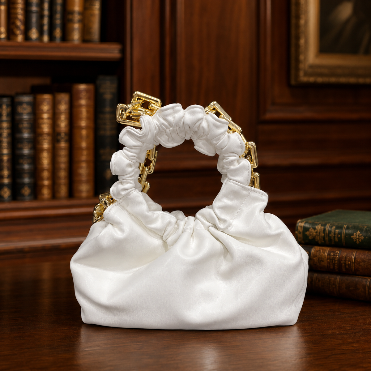White ruched cloud clutch with pearl-style circular handle