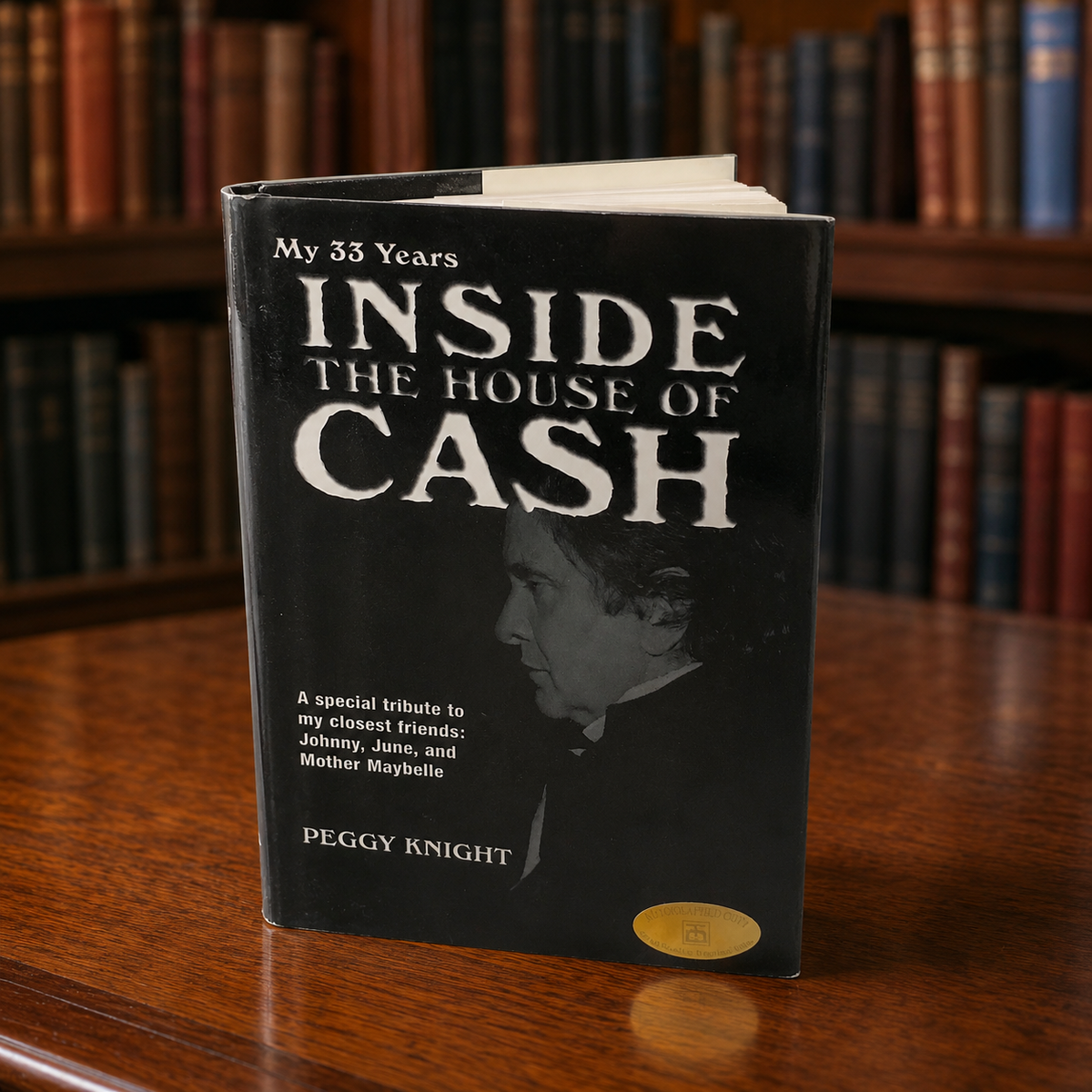 Inside the House of Cash by Peggy Knight, black cover with autographed copy sticker