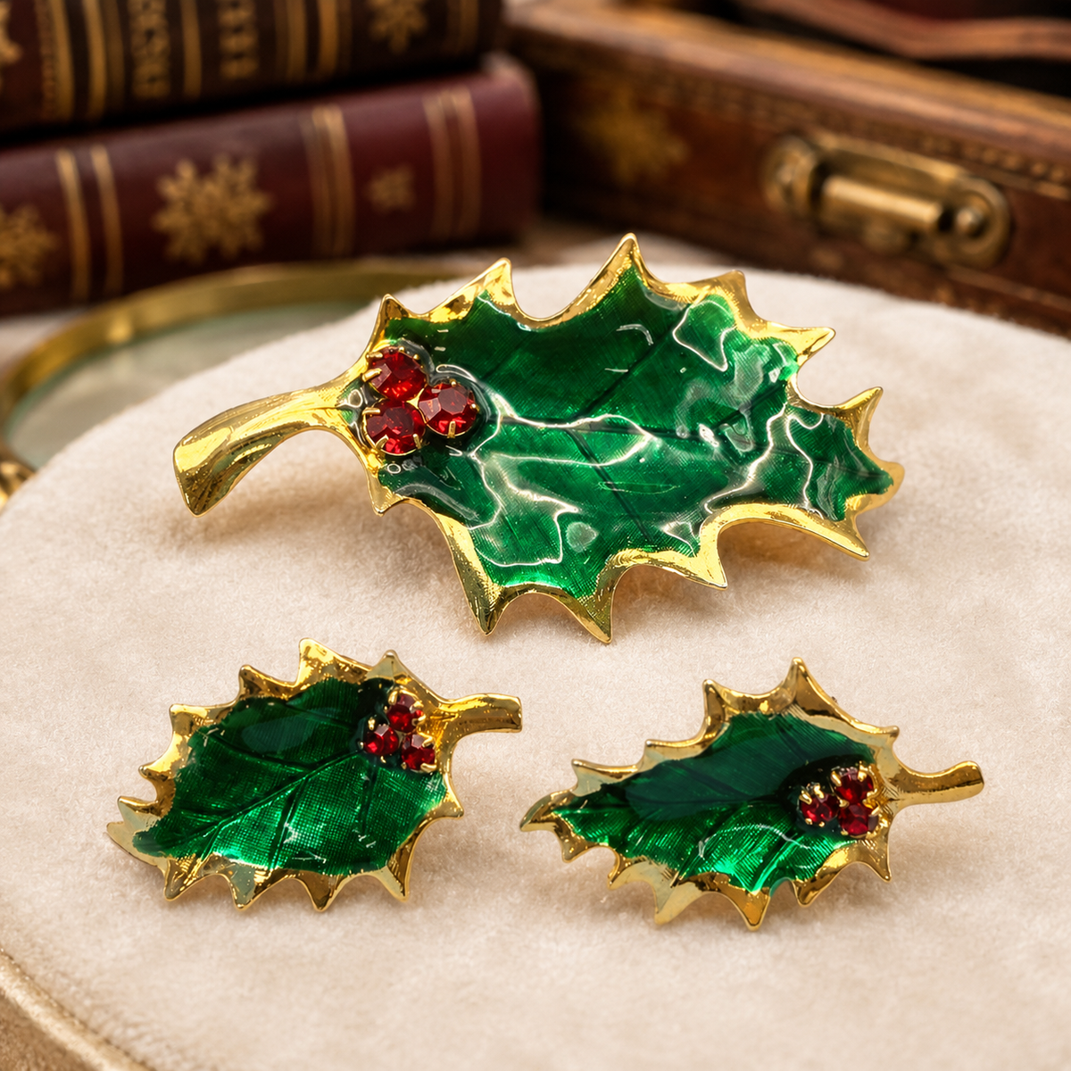 Green enamel holly leaf brooch and matching earrings with red rhinestone berries and gold-tone trim